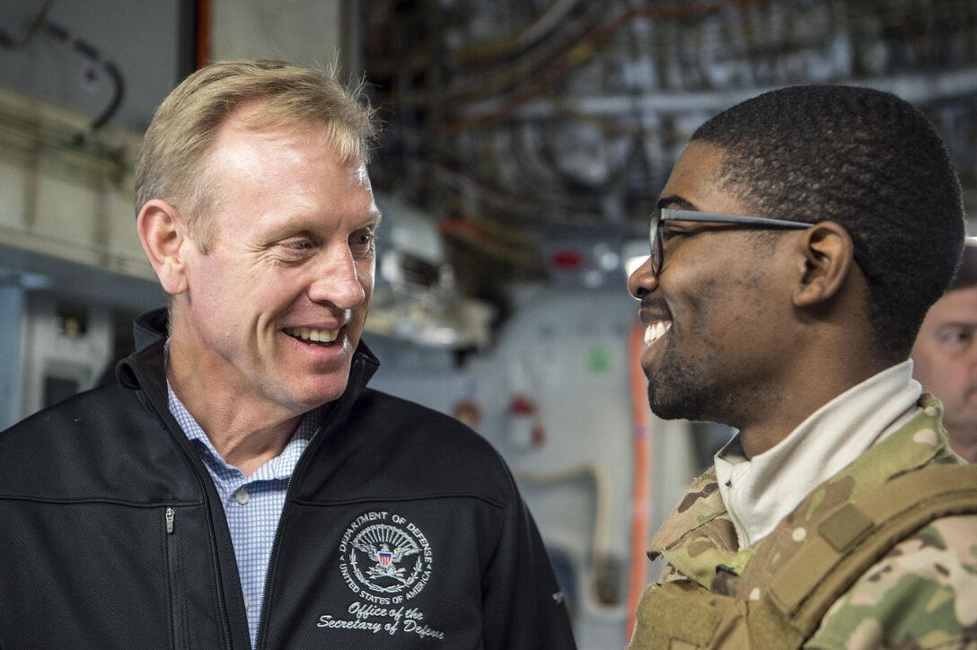 Deputy Defense Secretary Pat Shanahan speaks with a service member.