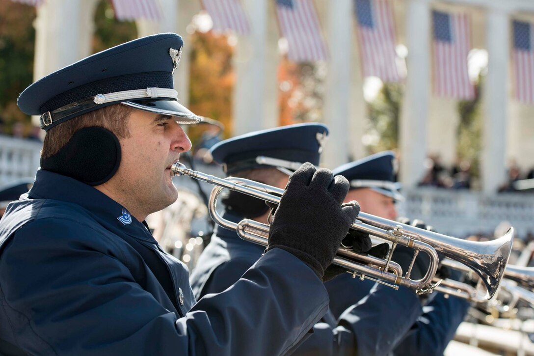 Tech. Sgt. Valentin Lukashuk, U.S. Air Force Concert Band trumpeter, performs during the 64th National Veterans Day Observance at Arlington National Cemetery in Arlington, Va., Nov. 11, 2017. The ceremony was held to honor and thank all who are serving and have served in the U.S. Armed Forces. (U.S. Air Force photo by Airman 1st Class Valentina Lopez)