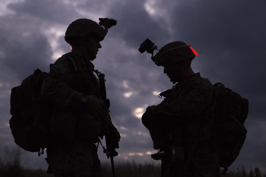 U.S. Marines perform a simulated night raid with multiple rifle squads during an air assault training event at Marine Corps Air Station Futenma, Okinawa, Japan, Oct. 31, 2017.