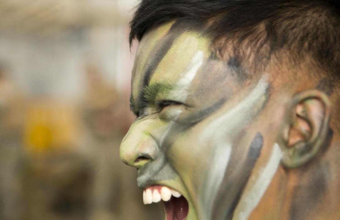 U.S. Marine Corps Cpl. Joshua Duarte gives a war cry prior to air assault training Oct. 31, 2017 on Marine Corps Air Station Futenma, Okinawa, Japan, in support of Blue Chromite 18.