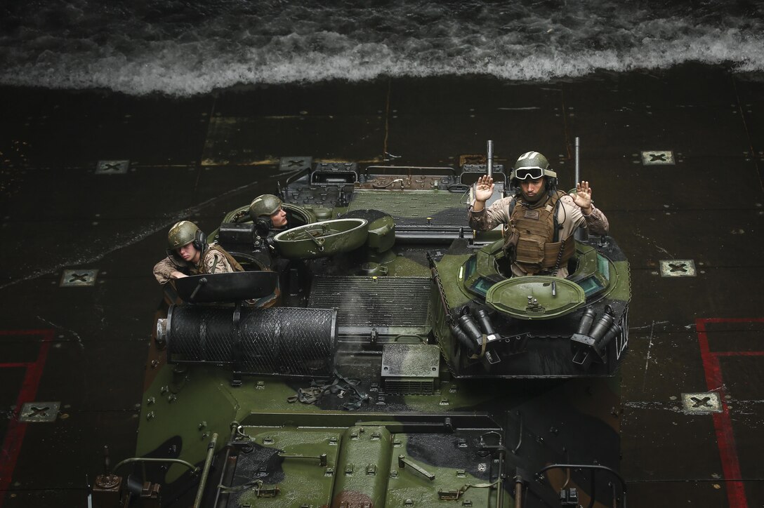 A U.S. Marine Amphibious Assault Vehicle boards the well deck of Amphibious Dock Landing Ship, USS Ashland (LSD 48), during Blue Chromite 18, somewhere off the coast of Okinawa, Japan, Nov 1, 2017.