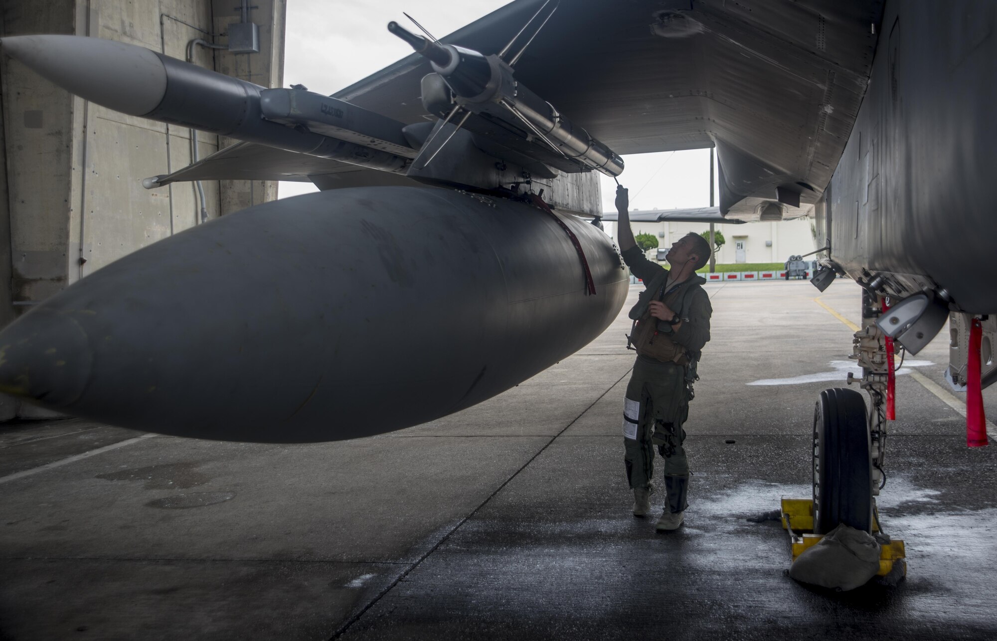 A U.S. Air Force pilot goes through pre-flight inspections on an F-15C Eagle Nov. 16, 2017, at Kadena Air Base, Japan.