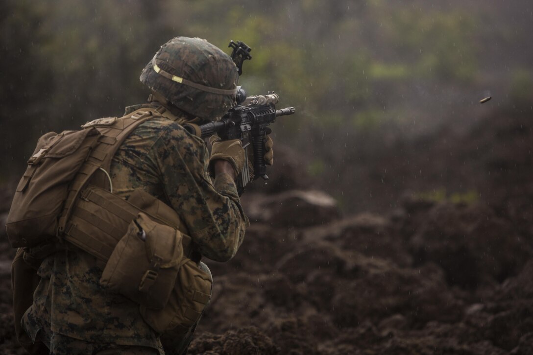 A U.S. Marine fires his rifle at targets while participating in the Infantry Platoon Battle Course at the Pohakuloa Training Area on the Island of Hawaii, Oct. 25, 2017.