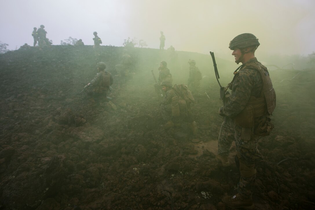 U.S. Marines hold their positions while attending the Infantry Platoon Battle Course at the Pohakuloa Training Area on the Island of Hawaii, Oct. 25, 2017.