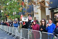 Thousands of spectators line the streets, waving flags and "thank you" signs, to show their appreciation for the nation's military veterans at the New York City Veterans Day Parade Nov. 11, 2017.