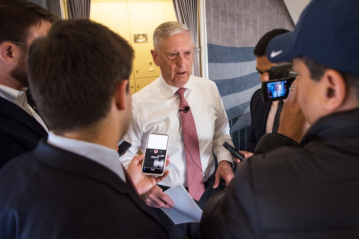 Defense Secretary Jim Mattis speaks to a group of people. 