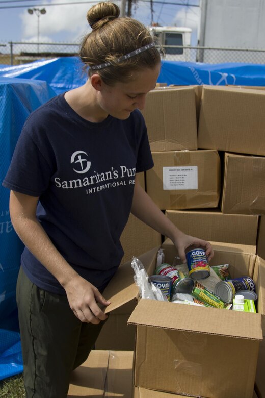 Volunteer Checks Grocery Box