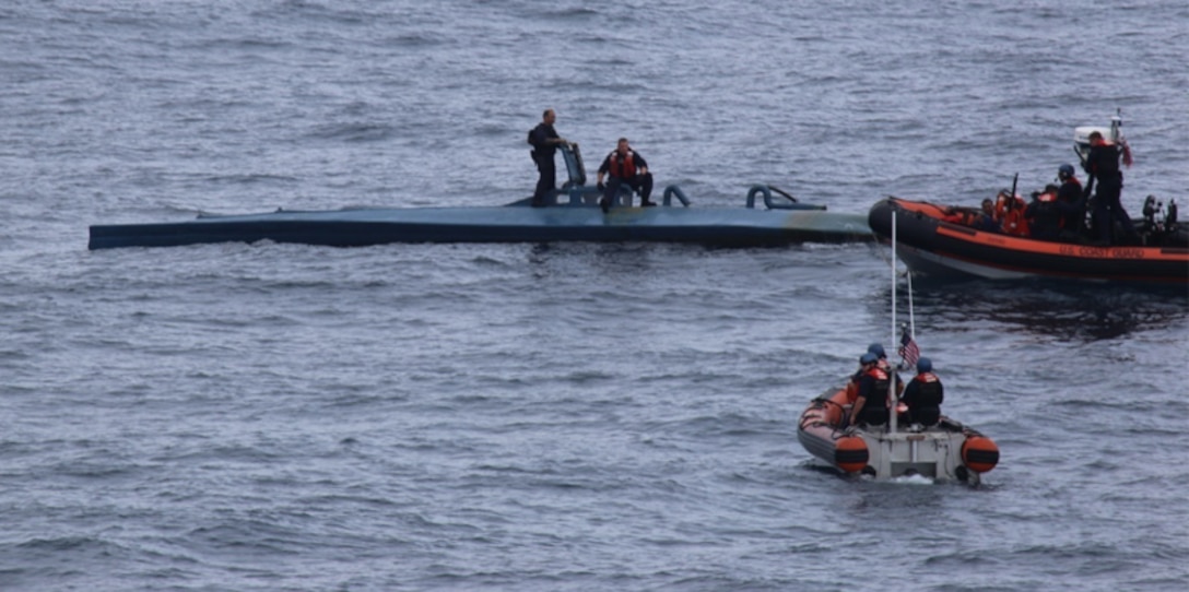 A U.S. Coast Guard boat crew interdicts a self-propelled semi submersible vessel.