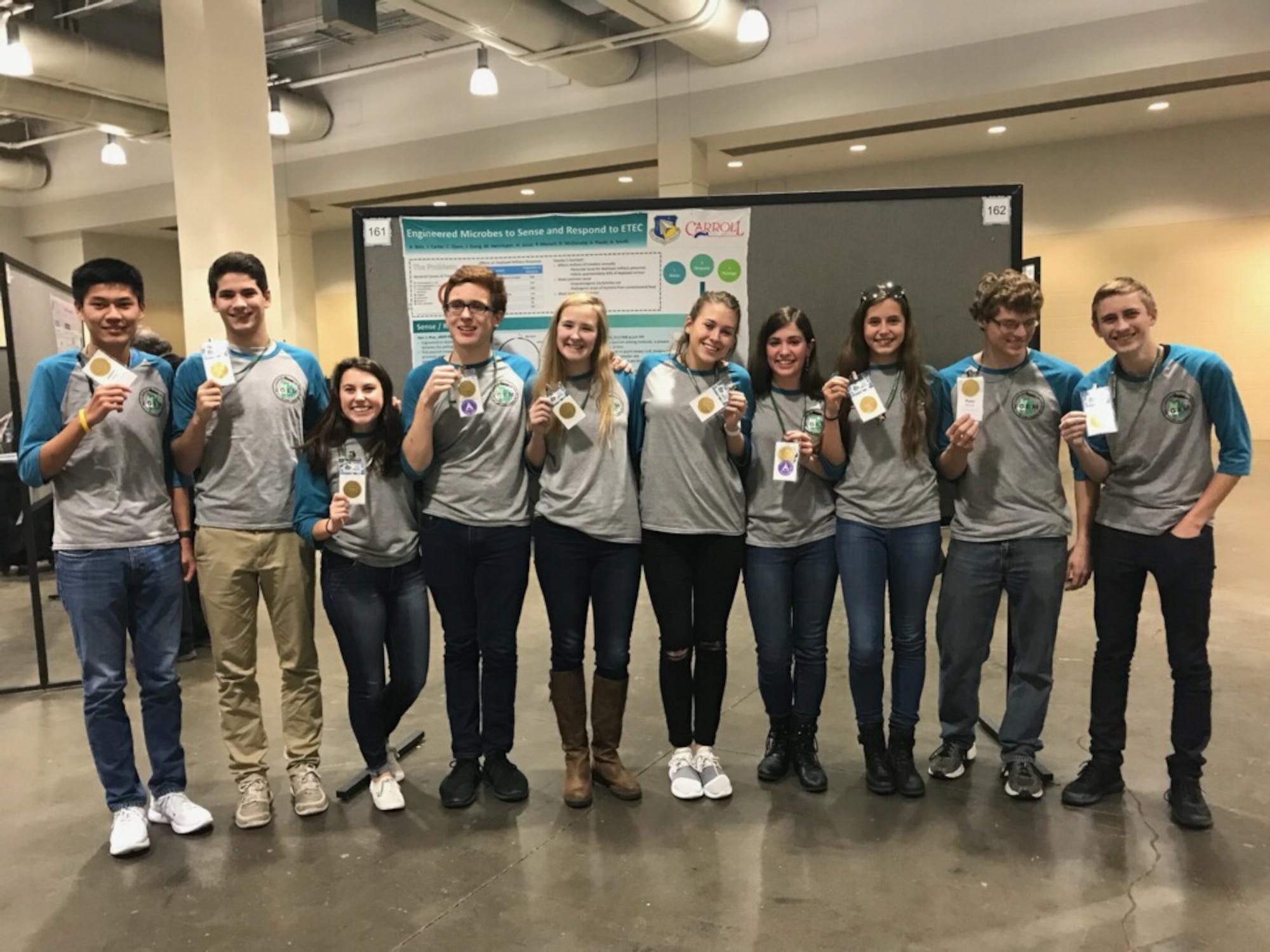 The Air Force Research Laboratory-Carroll High School iGEM team proudly displays their gold medals after the international iGEM competition in Boston Nov. 13.