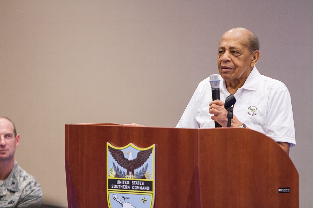 Dr. Harold Brown speaks with military men and women at U.S. Southern Command headquarters