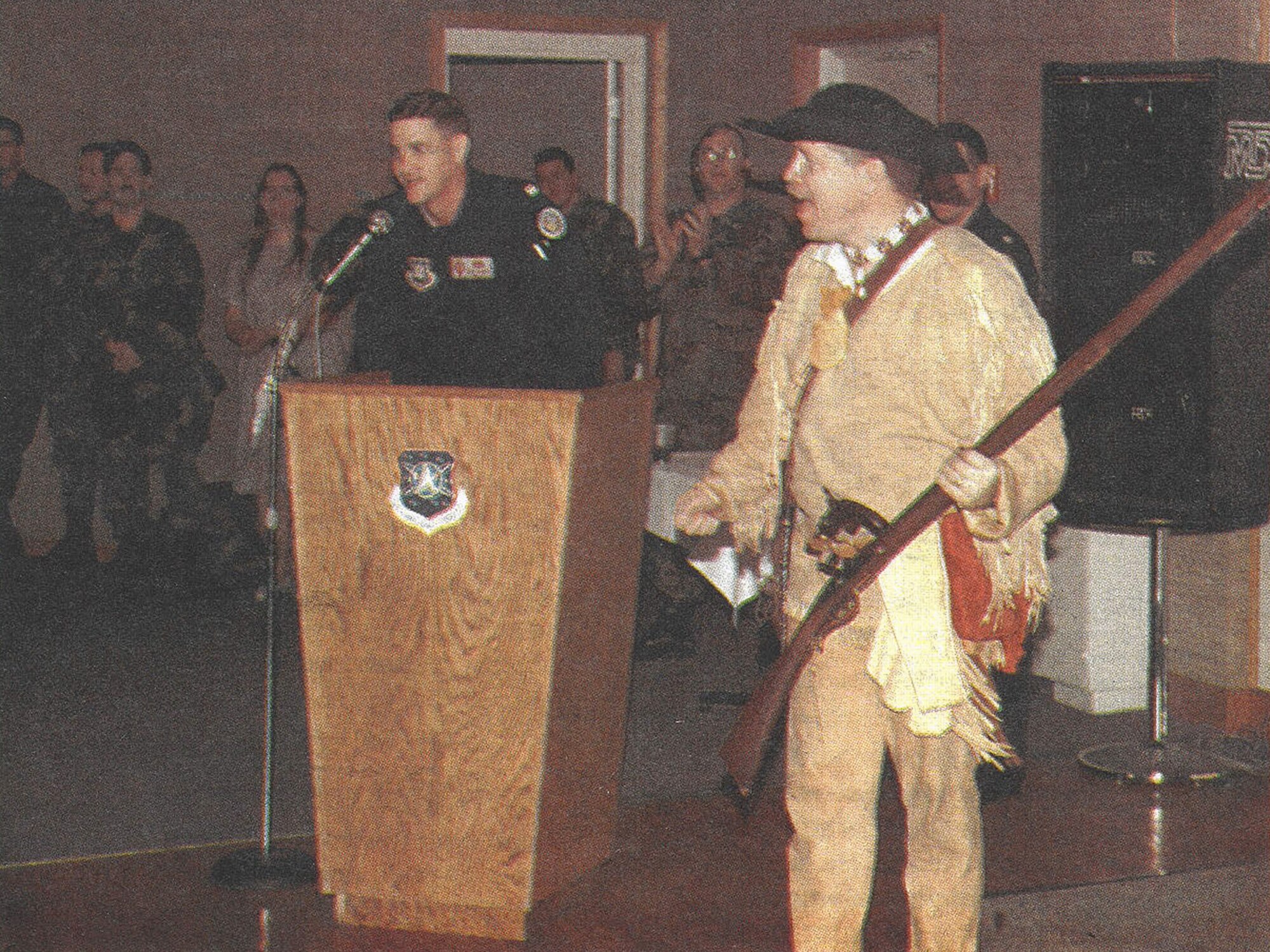 Capt. Peter Woelkers, 12th Missile Squadron, right, leads the 341st Missile Wing in a cheer at an Air Force Space Command Guardian Challenge 1997 Space and Missile Competition rally at Malmstrom Air Force Base, Mont. Mascots also acted as their team’s bus driver during competitions at Vandenberg AFB, Calif. Woelkers, a Lewis and Clark expedition living history interpreter, wore his own gear and clothing to give the High Plains Warrior an authentic frontier look. (Photo courtesy of 341st MW Historian Office)