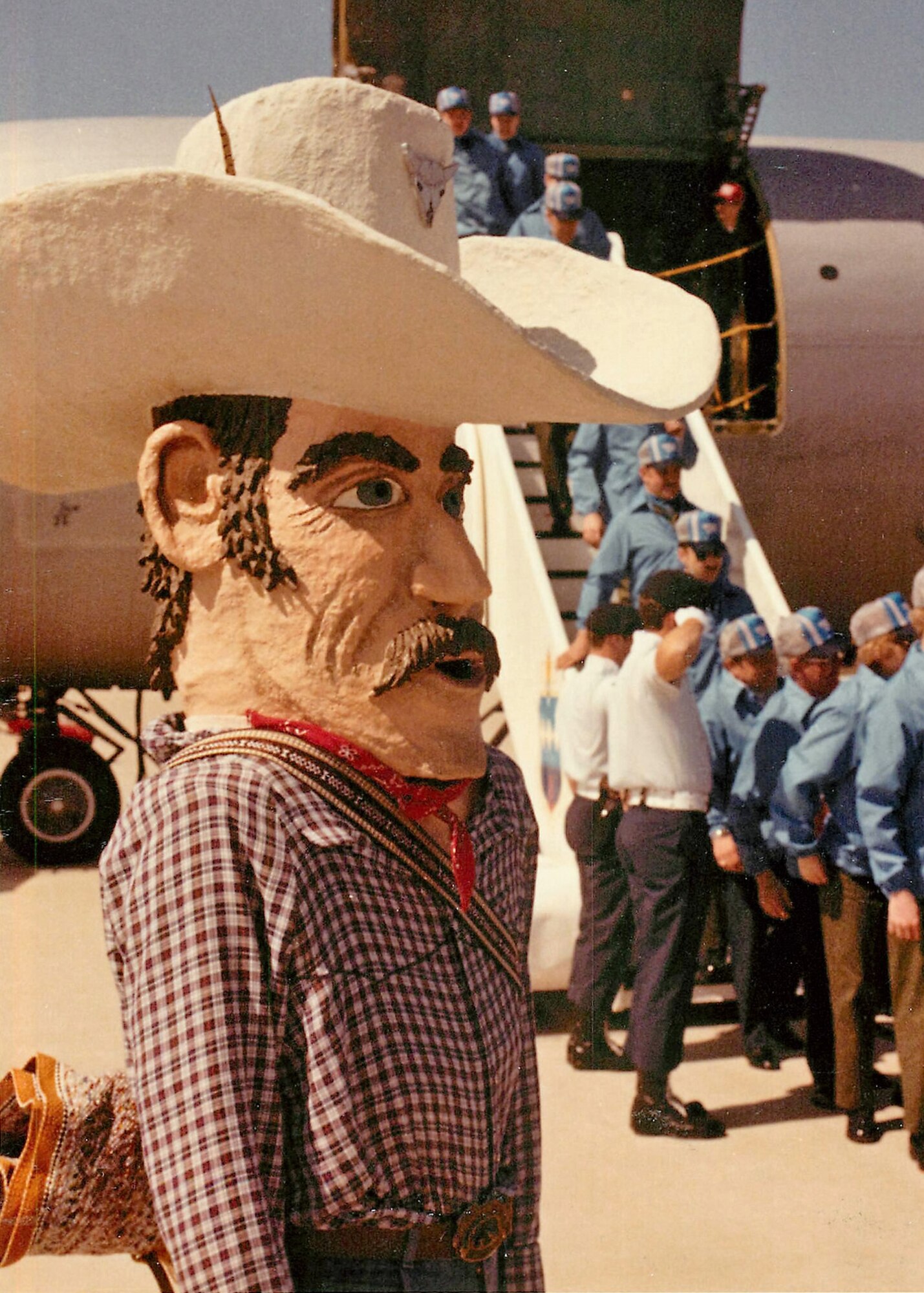 A caricature of a cowboy watches as the 341st Strategic Missile Wing’s Missile Combat Competition team disembarks from a KC-135 Stratotanker. A 1981 group photo of team mascots at Vandenberg Air Force Base, Calif., suggests this was the 341st SMW’s mascot in the early 1980s. (Photo courtesy of 341st MW Historian Office)
