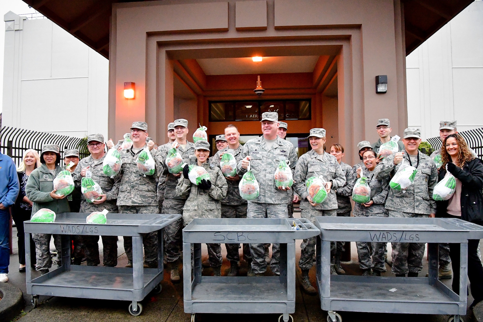 WADS members pose for a photo during the 8th annual Operation Turkey Drop, Nov. 16, 2017.  Operation Turkey Drop helps ease financial burdens of holiday expenses for Airmen and Soldiers on Joint Base Lewis-McChord and Camp Murray. The event is made possible by the Association of the United States Army, the Air Force Association and Pierce Military and Business Alliance and dozens of local businesses and organizations. (U.S. Air National Guard photo by Capt. Kimberly D. Burke)
