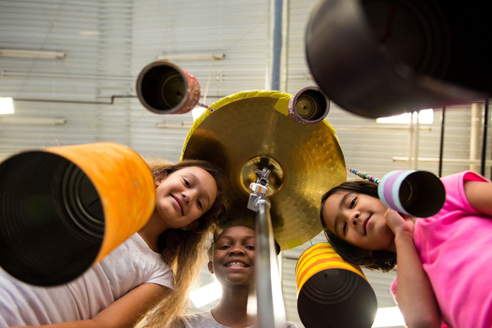 Children pose for a photo during the 23d Civil Engineer Squadron Recycling Science Fair, Nov. 15, 2017, at Moody Air Force Base, Ga. The 23d CES partnered with Moody's Youth Programs for America Recycles Day. The event consisted of a fashion show, as well as a recycle science fair. It was designed to help foster more interest in recycling, to increase recycling on base and promote less solid waste to landfills. (U.S. Air Force photo by Airman 1st Class Erick Requadt)