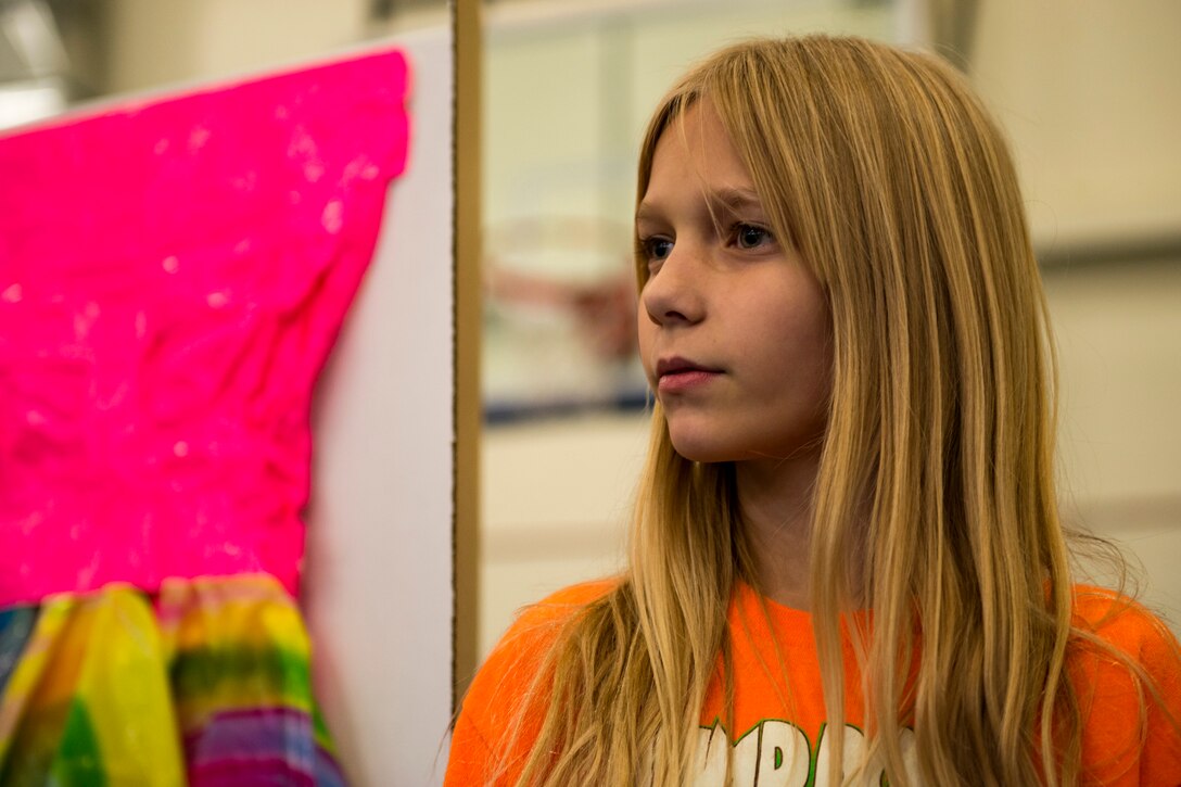 A recycled project participant waits to have her project judged during the 23d Civil Engineer Squadron Recycling Science Fair, Nov. 15, 2017, at Moody Air Force Base, Ga. The 23d CES partnered with Moody's Youth Programs for America Recycles Day. The event consisted of a fashion show, as well as a recycle science fair. It was designed to help foster more interest in recycling, to increase recycling on base and promote less solid waste to landfills. (U.S. Air Force photo by Airman 1st Class Erick Requadt)