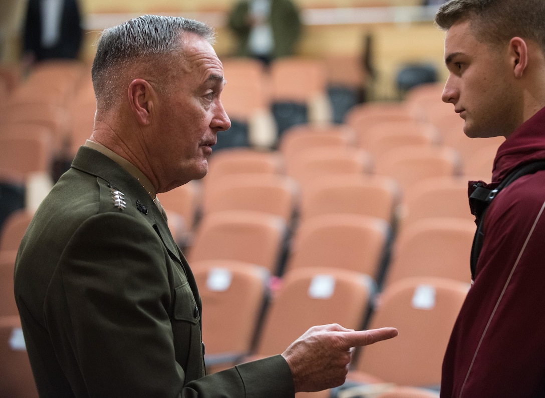 Marine Corps Gen. Joe Dunford speaks with a college student