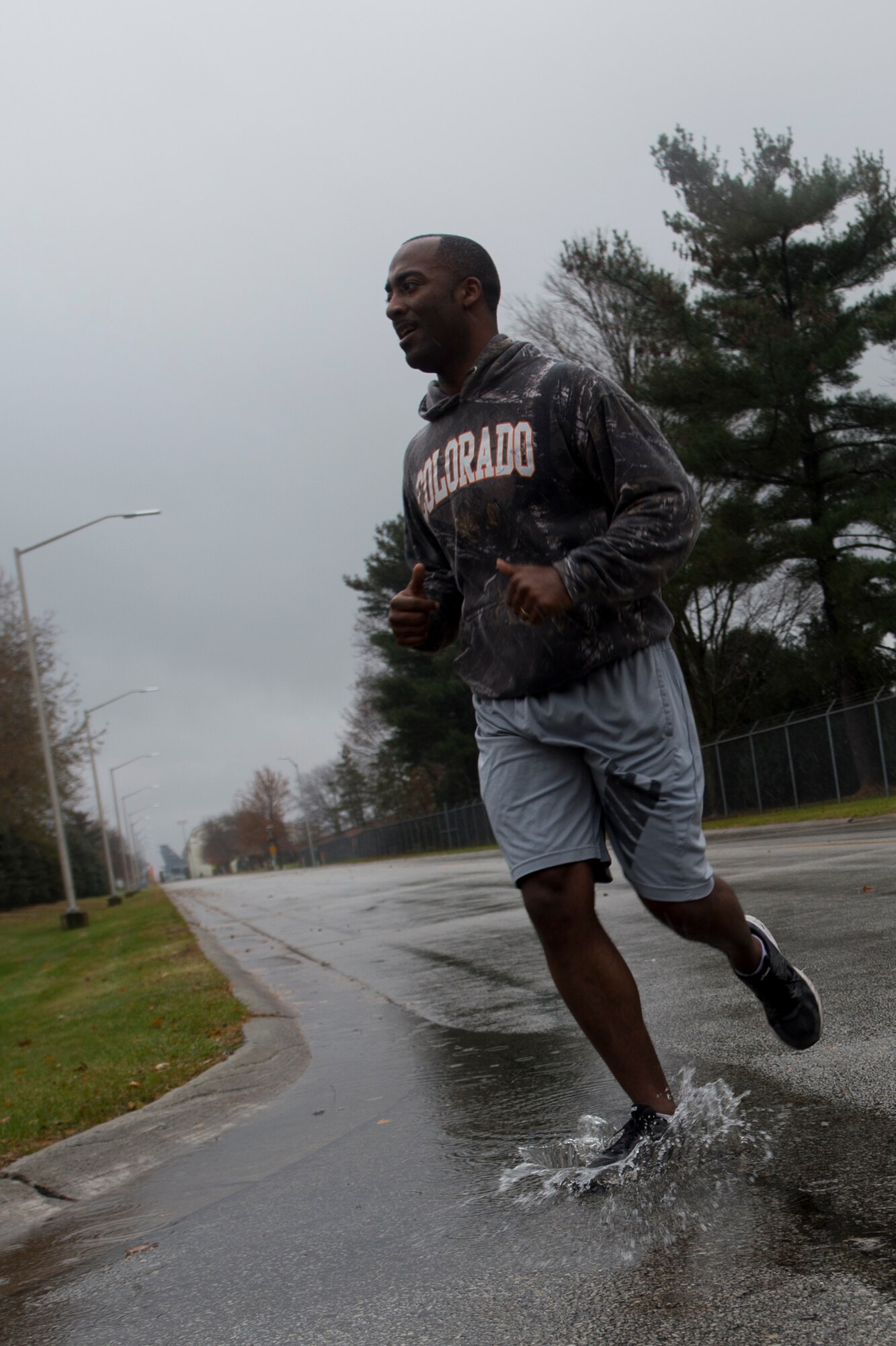 Capt. Chad Nickson, 434th Operation Support Squadron intelligence officer, runs through a puddle during Grissom’s annual Turkey Trot 5K on November 15, 2017 at Grissom Air Reserve Base, Ind. Despite the poor weather a small number of runners still participated in the run.
