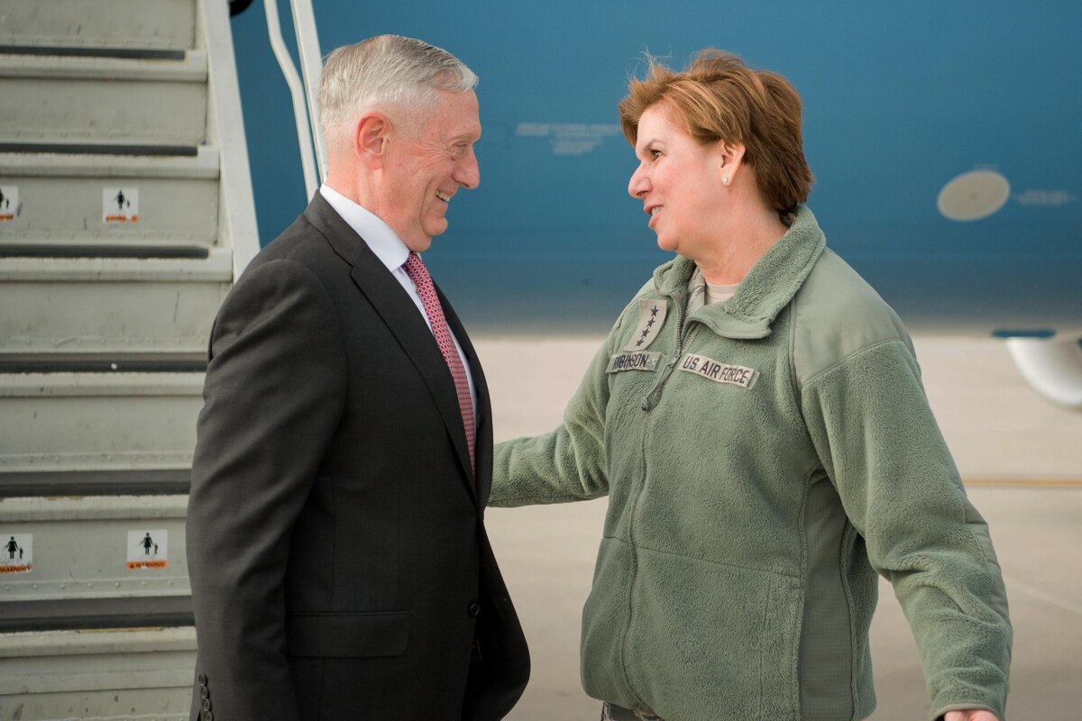 Defense Secretary Jim Mattis and an Air Force general stand next to each other. 
