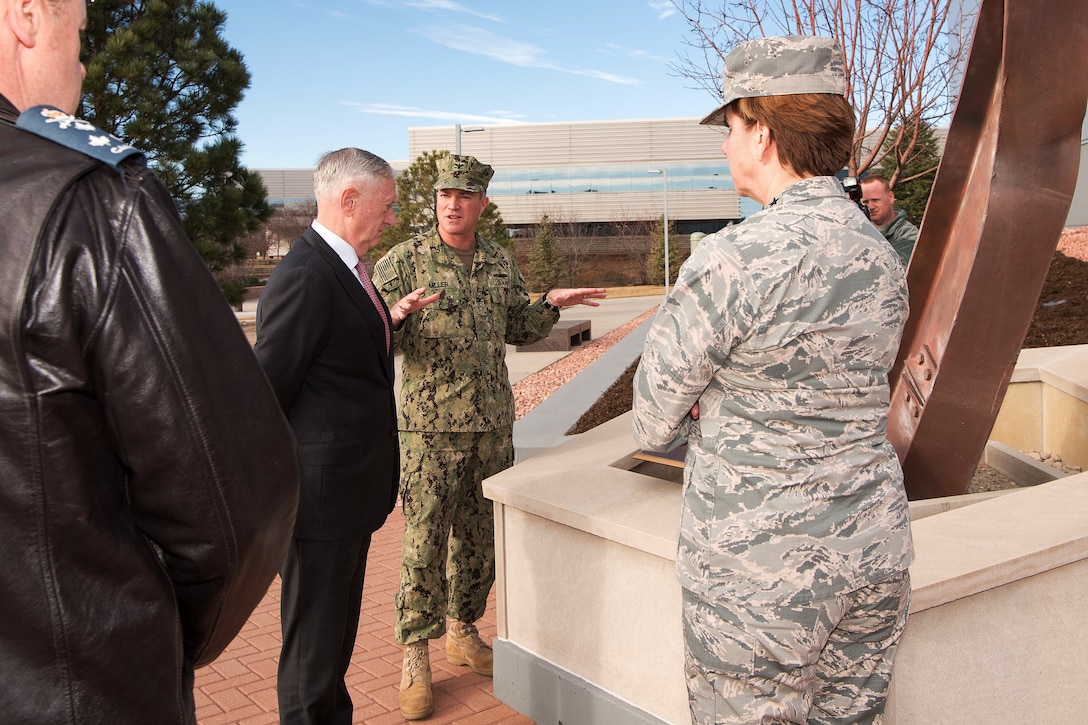 Defense Secretary Jim Mattis talks with military leaders.