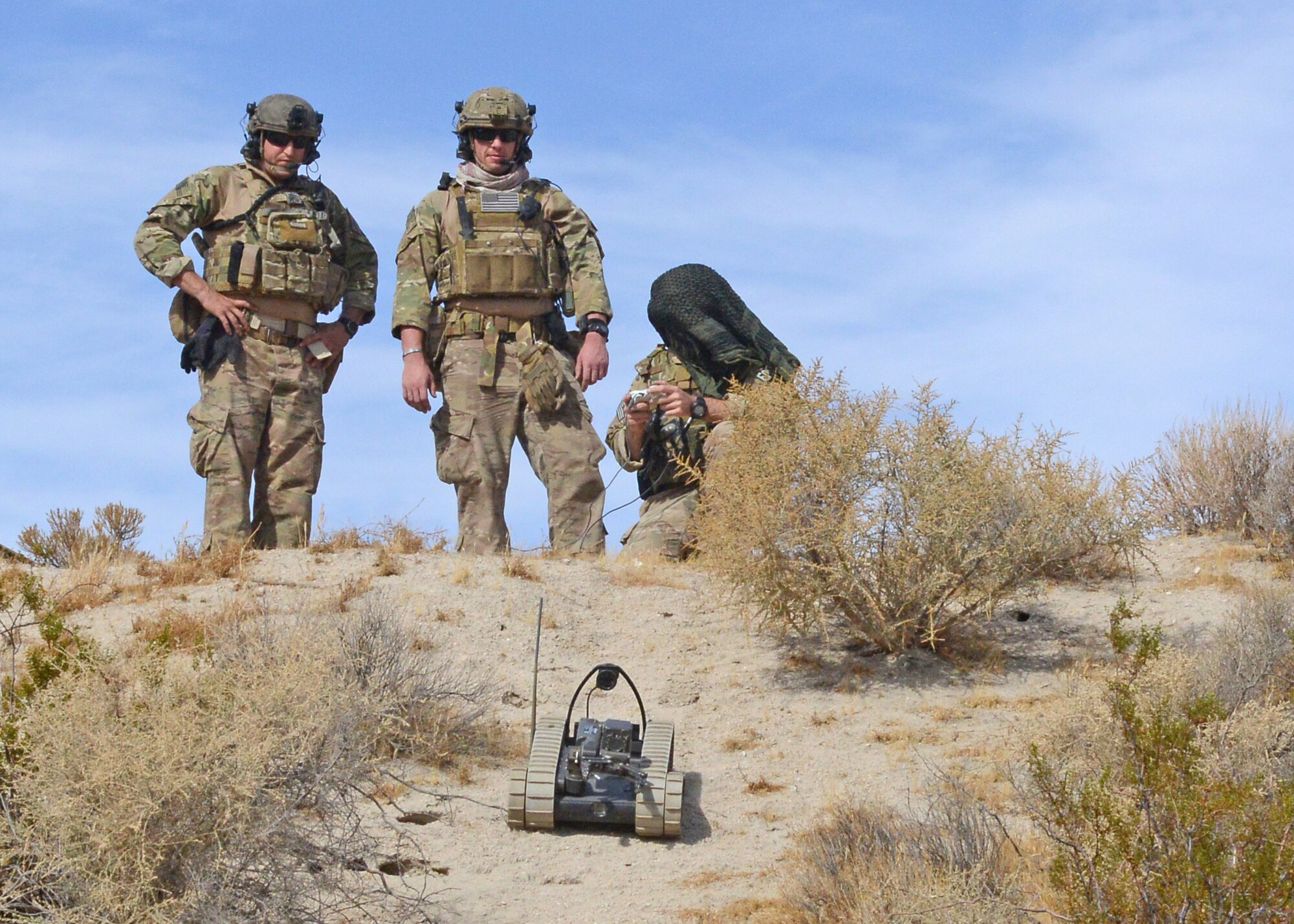 Explosive Ordnance Disposal Airmen deploy an all-terrain robot to inspect a possible booby trap during a two-week long training event and bivouac conducted by the 812th Civil Engineer Explosive Ordnance Flight at Edwards AFB earlier this month. (U.S. Air Force photo by Kenji Thuloweit)