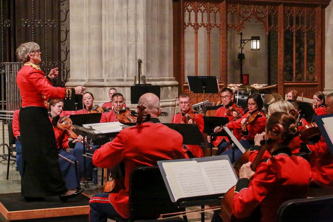 Major Michelle A. Rakers, assistant director, “The President’s Own” U.S. Marine Band, conducts the band during a Marine Corps Worship Service at the Washington National Cathedral, Washington D.C., Nov. 12, 2017. The service was held to commemorate the 242nd Anniversary of the Marine Corps. The 19th Chaplain of the Marine Corps, Rear Adm. Brent W. Scott, addressed his message to the guests in attendance. (Official U.S. Marine Corps photo by Cpl. Robert Knapp/Released)