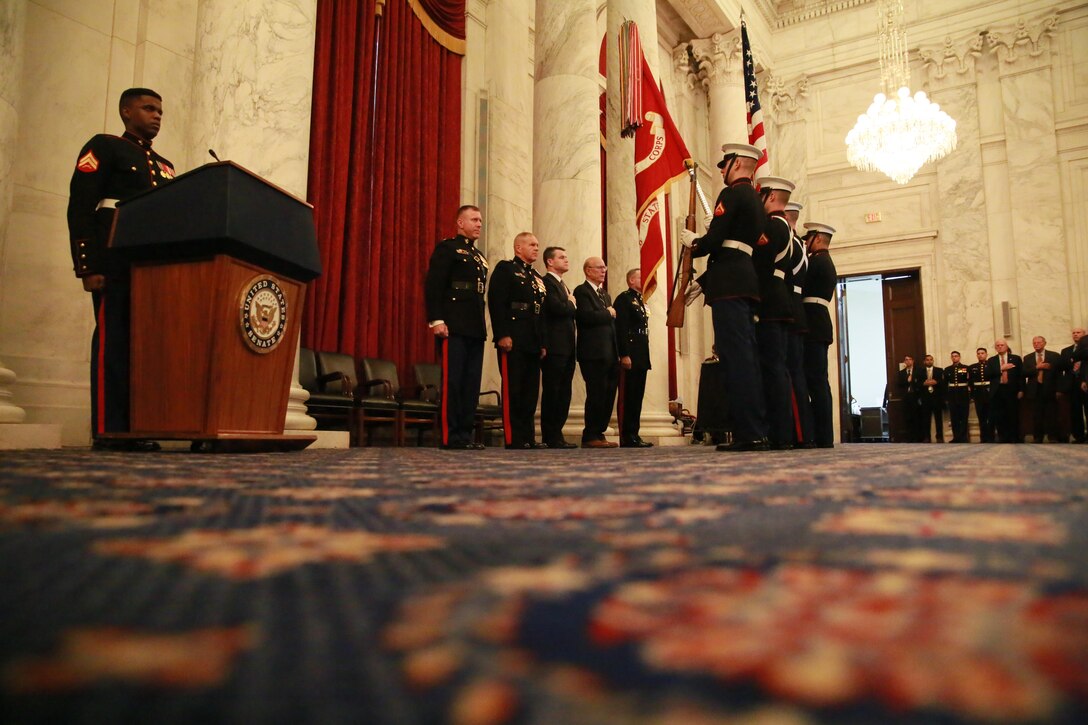 Members of the official party render honors as the National and Marine Corps Colors are presented by the U.S. Marine Corps Color Guard during a cake cutting ceremony to celebrate the Marine Corps’ 242nd birthday at the Russell Senate Office Building, Washington D.C., Nov. 15, 2017. The guest of honor for the ceremony was the Senator of Indiana, the Honorable Todd Young, and the hosting official was the Commandant of the Marine Corps, Gen. Robert B. Neller. (Official U.S. Marine Corps photo by Cpl. Robert Knapp/Released)