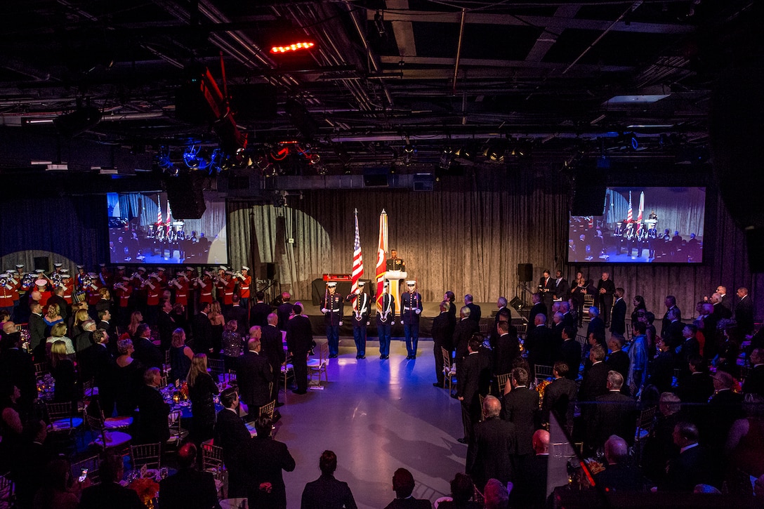 The U.S. Marine Corps Color Guard presents the National and Marine Corps Colors during the 242nd Marine Corps Birthday Gala aboard the USS Intrepid Sea, Air, and Space Museum, New York City, NY, Nov. 8, 2017. Every year, the Barracks travels throughout the National Capital Region and numerous other locations to honor and celebrate the birthday of the Corps. (Official U.S. Marine Corps photo by Cpl. Robert Knapp/Released)