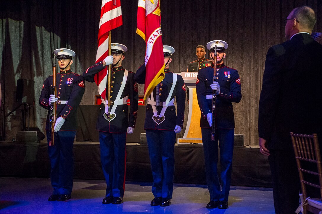 The U.S. Marine Corps Color Guard presents the National and Marine Corps Colors during the 242nd Marine Corps Birthday Gala aboard the USS Intrepid Sea, Air, and Space Museum, New York City, NY, Nov. 8, 2017. Every year, the Barracks travels throughout the National Capital Region and numerous other locations to honor and celebrate the birthday of the Corps. (Official U.S. Marine Corps photo by Cpl. Robert Knapp/Released)