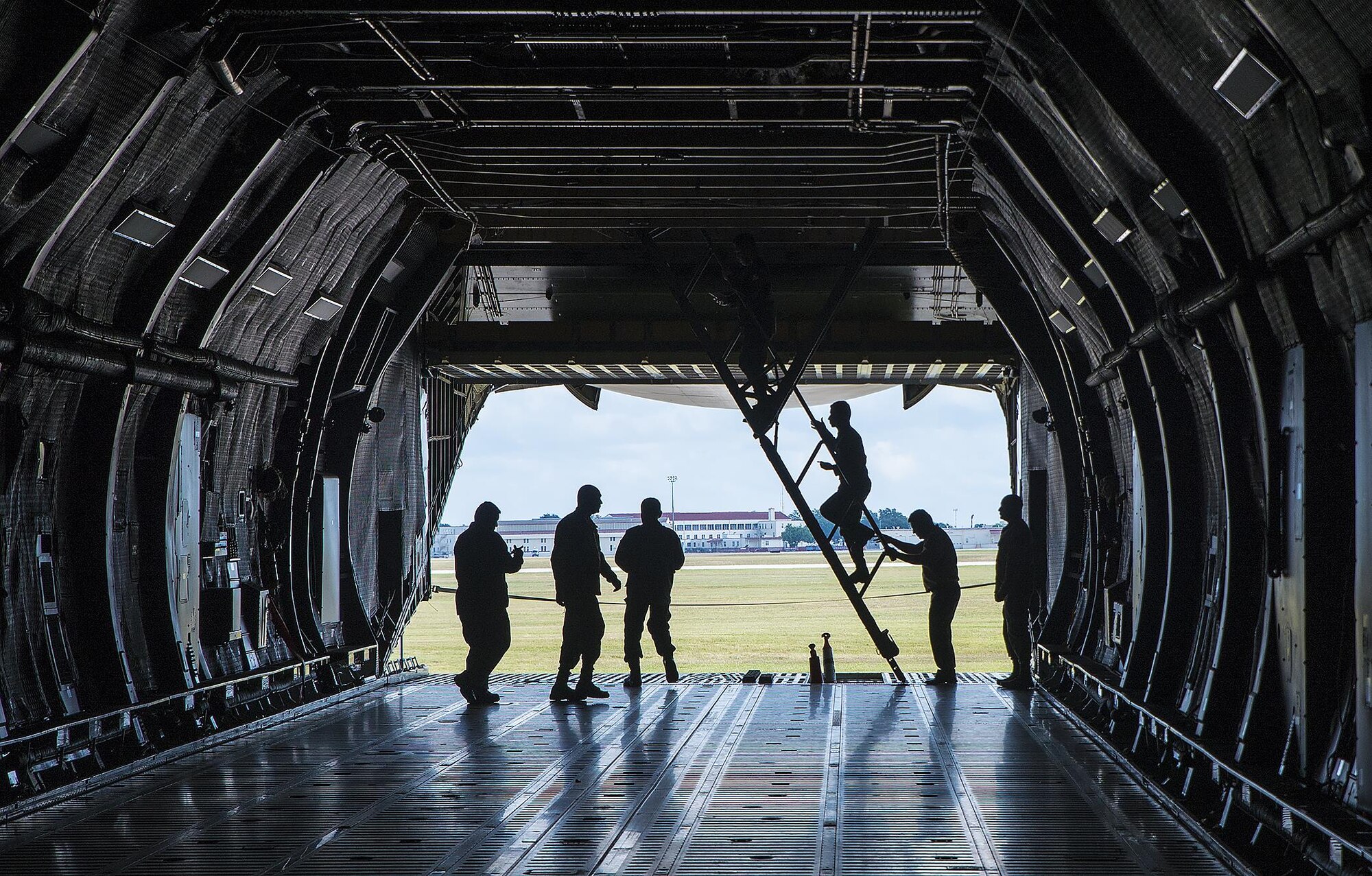 Students from the Inter-American Air Force Academy climb the stairs to the troop compartment on on a C-5M Super Galaxy aircraft at the 433rd Airlift Wing November 15, 2017 at Joint Base San Antonio-Lackland.