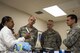 Sandra Pittman, 23d Medical Group (MDG) dental assistant, briefs Lt. Gen. Mark Ediger, Surgeon General of the Air Force (AF/SG), Brig. Gen. Sean Murphy, Air Combat Command Surgeon General (ACC/SG), and Chief Master Sgt. George Cum, Air Force Chief of Medical Enlisted Force Nov. 15, 2017, at Moody Air Force Base, Ga. The AF/SG and ACC/SG visited Moody to get a better understanding of the 23d MDG’s mission. (U.S. Air Force photo by Airman Eugene Oliver)