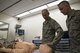 Lt. Gen. Mark Ediger, Surgeon General of the Air Force (AF/SG), left, and Chief Master Sgt. George Cum, Air Force Chief of Medical Enlisted Force, examine a mannequin, Nov. 15, 2017, at Moody Air Force Base, Ga. The AF/SG visited Moody to get a better understanding of the 23d MDG’s mission. (U.S. Air Force photo by Airman Eugene Oliver)