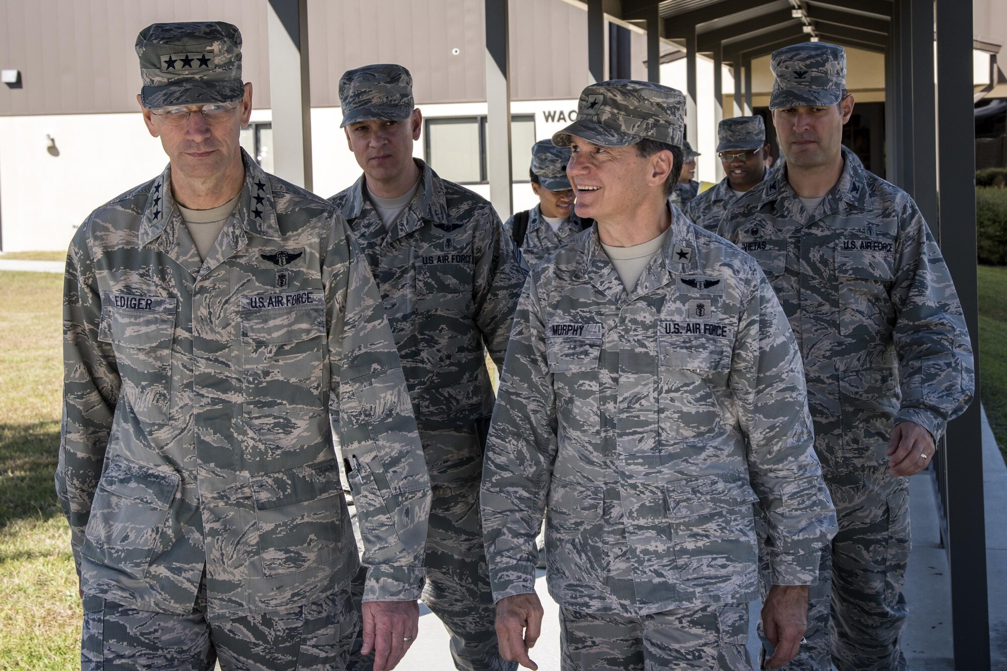 Lt. Gen. Mark Ediger, Surgeon General of the Air Force (AF/SG), left, and Brig. Gen. Sean Murphy, Air Combat Command Surgeon General (ACC/SG) walk out of the Warrior Athlete Center of Excellence, Nov. 15, 2017, at Moody Air Force Base, Ga. The AF/SG and ACC/SG visited Moody to get a better understanding of the 23d Medical Group’s mission. (U.S. Air Force photo by Airman Eugene Oliver)