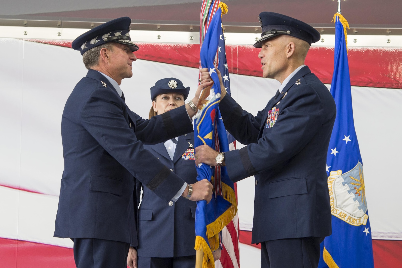 U.S. Air Force Chief of Staff Gen. David L. Goldfein, hands the guidon to Lt. Gen. Steven Kwast officially signifying his assumption of command of Air Education and Training Command Nov. 16, 2017, at Joint Base San Antonio-Randolph, Texas. Kwast, a U.S. Air Force Academy graduate, assumed command after spending the previous three years as president and commander of Air University, Maxwell Air Force Base, Alabama (U.S. Air Force photo by Sean Worrell)