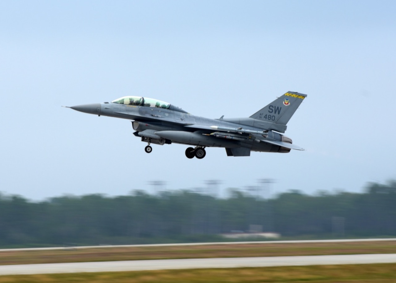 An Air Force F-16CM Fighting Falcon from the 79th Fighter Squadron, Shaw Air Force Base, S.C., soars over the flight line at Tyndall Air Force Base, Fla., Nov. 9, 2017. Shaw AFB sent assets to Tyndall to participate in exercise Checkered Flag 18-1 and Combat Archer. Air Force photo by Airman 1st Class Isaiah J. Soliz