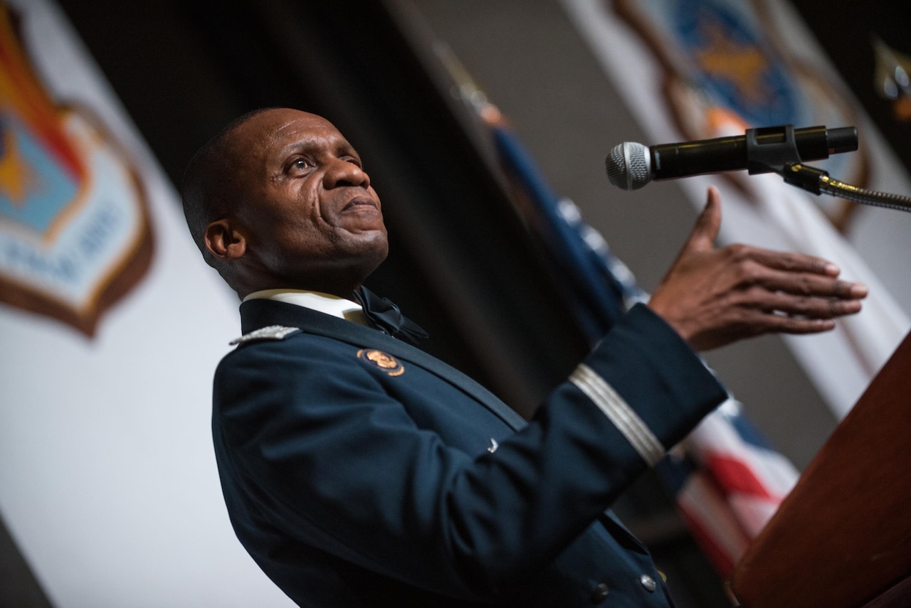Air Force Gen. Darren W. McDew speaks at a podium