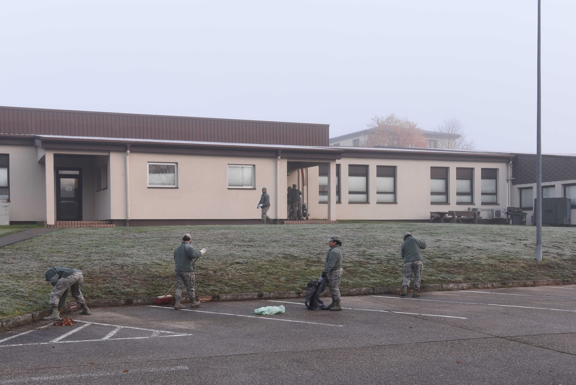 U.S. Airmen assigned to the 86th Comptroller Squadron clean outside their squadron on Ramstein Air Base Nov. 14, 2017.The ‘Base Pride’ cleanup program is mandatory for every unit in the Kaiserslautern Military Community.