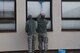 U.S. Airmen assigned to the 86th Comptroller Squadron, clean a window outside their office on Ramstein Air Base Nov. 14, 2017. Each unit was responsible for cleaning the areas within a 100-feet of their building.