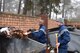 U.S. Air Force Senior Airman Nicholas Migliore, 86th Security Forces member, removes leaves and trash from around the dumpster on Ramstein Air Base, Nov. 15, 2017. The Base Pride program allows Airman to clean where they work and clean where they live.