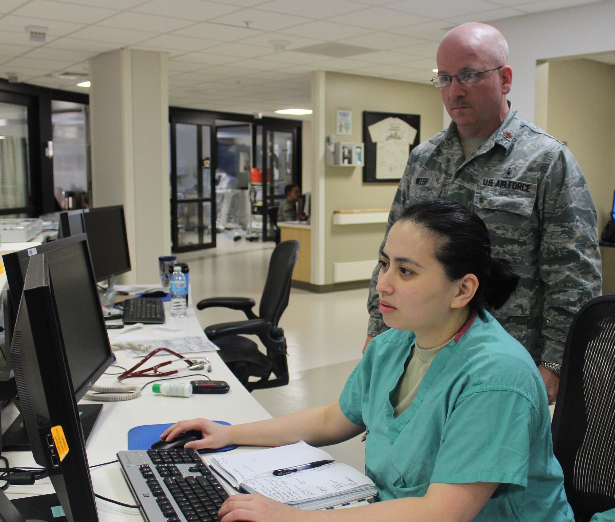 Maj. Gary Webb, 88th Inpatient Operations Squadron Critical Care Flight Commander reviews patient information with Capt. Lady Laarni Domingo, 88th Medical Group ICU nurse and Critical Care Registered Nurse certified. All the military nursing staff in the ICU are now CCRN certified. Certification reinforces the specialized knowledge and experiences required to care for acute and critically ill patients.