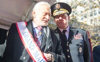 (Left) Buzz Aldrin, Grand Marshall of this year's NYC Veterans Day Parade, and (Right) Maj. Gen. Mark W. Palzer, commander of the 79th Theater Sustainment Command, observe the parade from the review stand, November 11, 2017. (U.S. Army Reserve Photo by Maj. Addie Leonhardt, 80th Training Command)