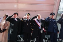 (Left to Right) Mrs. Donna Wartski; Mr. Jim Wartski; Army Reserve Maj. Gen. Mark Palzer, commander of the 79th Theater Sustainment Command; Mr. Buzz Aldrin, Grand Marshall; and Air Force Maj. Ronald Franco salute the 77th Sustainment Brigade and 80th Training Command Soldiers marching past the review stand at the NYC Veterans Day Parade, November 11, 2017. (U.S. Army Reserve Photo by Maj. Addie Leonhardt, 80th Training Command).