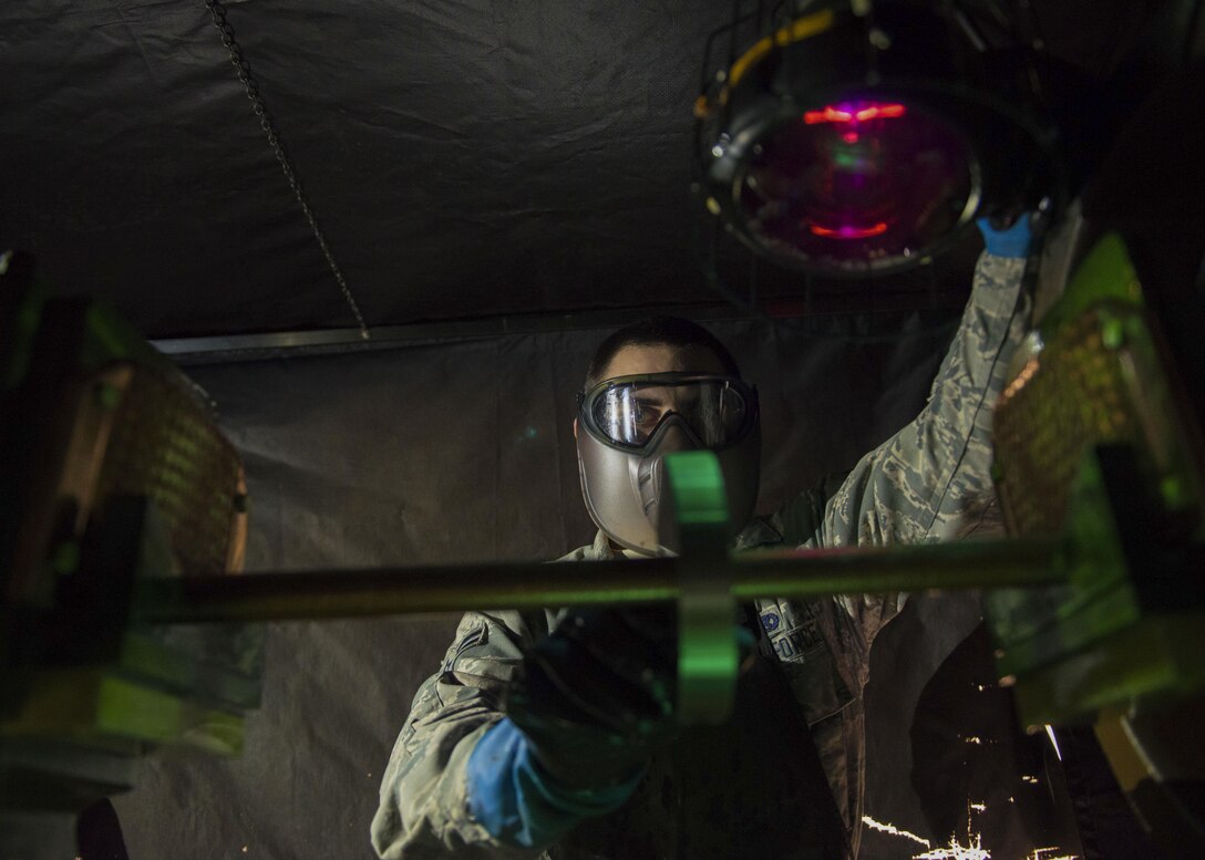 U.S. Air Force Airman 1st Class Brandon Pfeilmeier, 1st Maintenance Squadron nondestructive inspection apprentice, inspects a part at Joint Base Langley-Eustis, Va., Nov. 15, 2017.