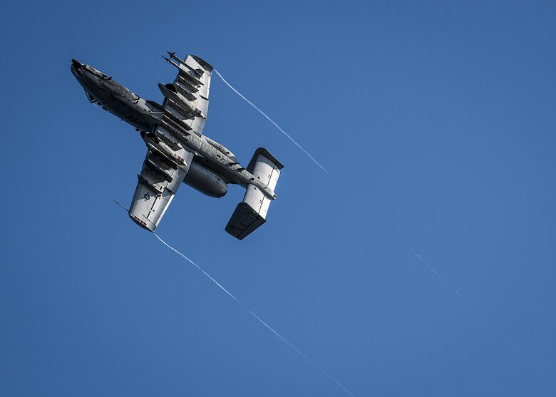 A 75th Fighter Squadron A-10 soars away after zooming in to target boats along Choctawatchee Bay during a Combat Hammer evaluation Nov. 3 at Eglin Air Force Base, Fla.  The boats swarm around the water creating a realistic environment to provide pilots an opportunity to train against maritime targets. The 86th Fighter Weapons Squadron’s Combat Hammer is a weapons system evaluation program for air-to-ground munitions. (U.S. Air Force/Samuel King Jr.)