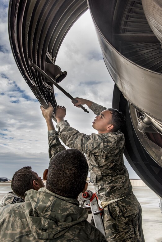 Airman 1st Class Juan Melendez, 660th Aircraft Maintenance Squadron, opens up a service panel to access a KC-10 Extender aircraft engine, Nov. 3, 2017, at Travis Air Force Base, Calif. The 660th AMXS is responsible for the safety and reliability of the fleet, thus strengthening American air power across the globe. (U.S. Air Force photo by Heide Couch)