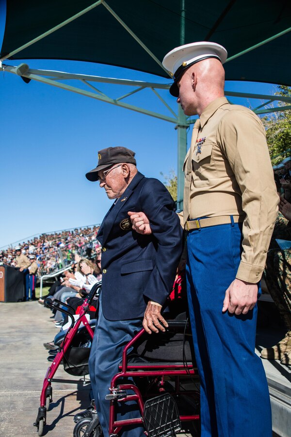 Retired Marine Corps Sgt. Maj. Ray V Wilburn, stands in recognition of all those who fought in the Korean-War during the Marine Corps Birthday Pageant, at Lance Cpl. Torrey L. Gray Field aboard the Marine Corps Air Ground Combat Center, Twentynine Palms, Calif., Nov. 08, 2017. The event included a historical uniform pageant and the traditional cake cutting ceremony in honor of the Marine Corps birthday. (U.S. Marine Corps photo by Pfc. William J. Chockey III)