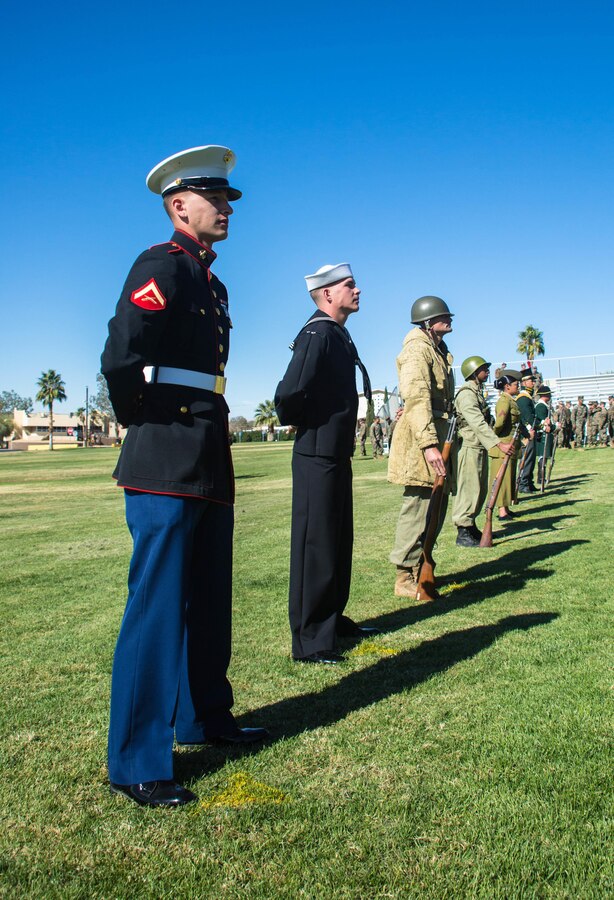 The historically uniformed Marines stand at parade rest during the Marine Corps Birthday Pageant, at Lance Cpl. Torrey L. Gray Field aboard the Marine Corps Air Ground Combat Center, Twentynine Palms, Calif., Nov. 08, 2017. The event included a historical uniform pageant and the traditional cake cutting ceremony in honor of the Marine Corps birthday. (U.S. Marine Corps photo by Pfc. William J. Chockey III)