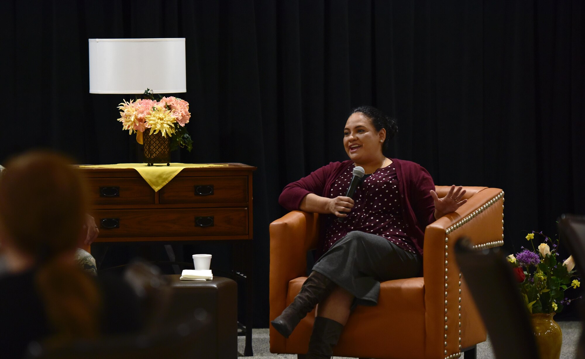 Maria Fussell, an education specialist assigned to the 509th Force Support Squadron, shares the personal trials she has had to overcome with members of Team Whiteman during the Storytellers event at Whiteman Air Force Base, Mo., Nov. 15, 2017.