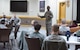 U.S. Air Force Staff Sgt. Bryan Robinson, a military working dog handler assigned to the 509th Security Forces Squadron, and Maria Fussell, an education specialist assigned to the 509th Force Support Squadron, share personal trials they have had to overcome with members of Team Whiteman during the Storytellers event at Whiteman Air Force Base, Mo., Nov. 15, 2017.