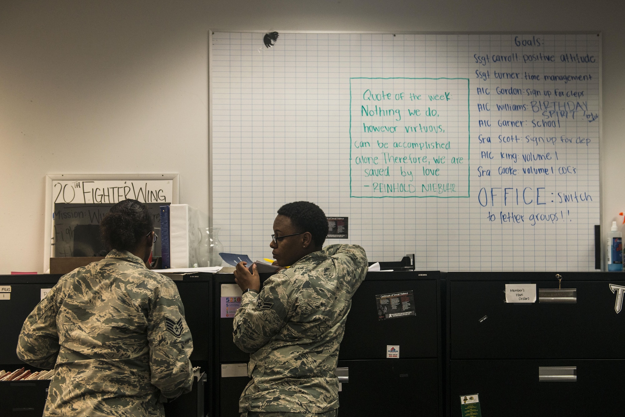 U.S. Air Force Staff Sgt. Jasmine Turner, 20th Force Support Squadron (FSS) career development supervisor, left, and Airman 1st Class Lakeia Garner, 20th FSS outbound assignments personnel specialist, work on the office goal to transition to letter groups at Shaw Air Force Base, South Carolina, Nov. 13, 2017.