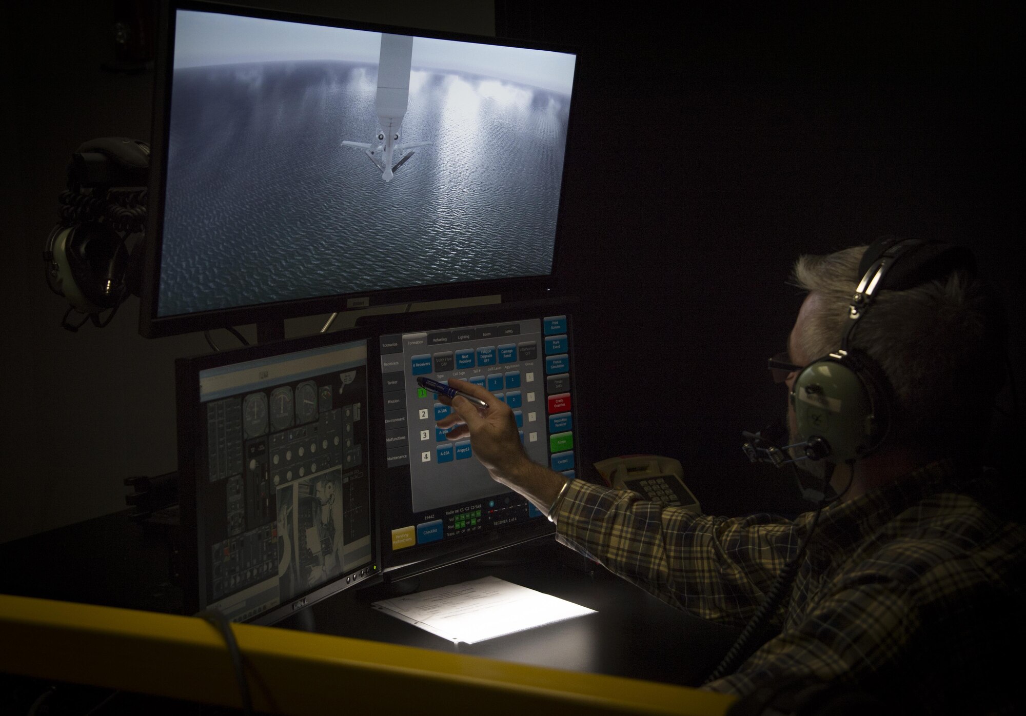 John Mercer, a Boom Operator Weapon System Trainer (BOWST) Instructor assigned to the 6th Operations Support Squadron, operates the instructor portion of the BOWST, Nov. 8, 2017, at MacDill Air Force Base, Fla. The simulator educates Airmen at all levels to be better equipped to deal with unusual circumstances during aerial refueling. (U.S. Air Force photo by Senior Airman Mariette Adams)